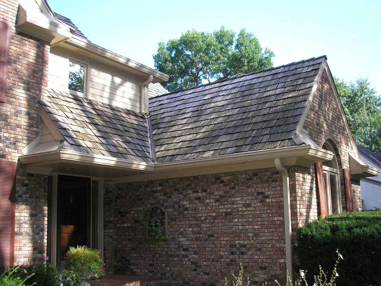 LeaFree installed along a roofline, color-matched to the gutters.