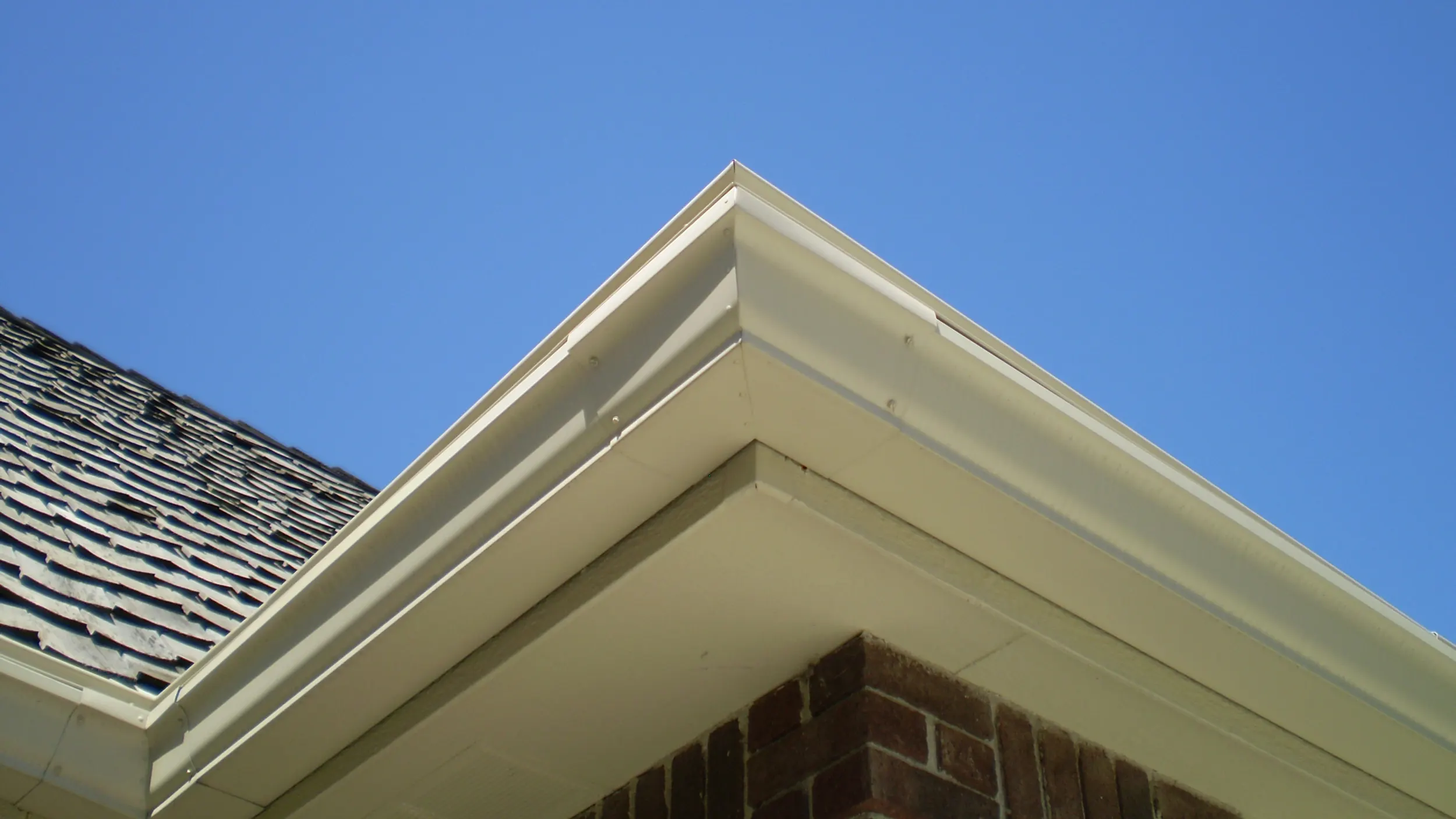 The view from the yard: a cleaner roofline, not a bolt-on.